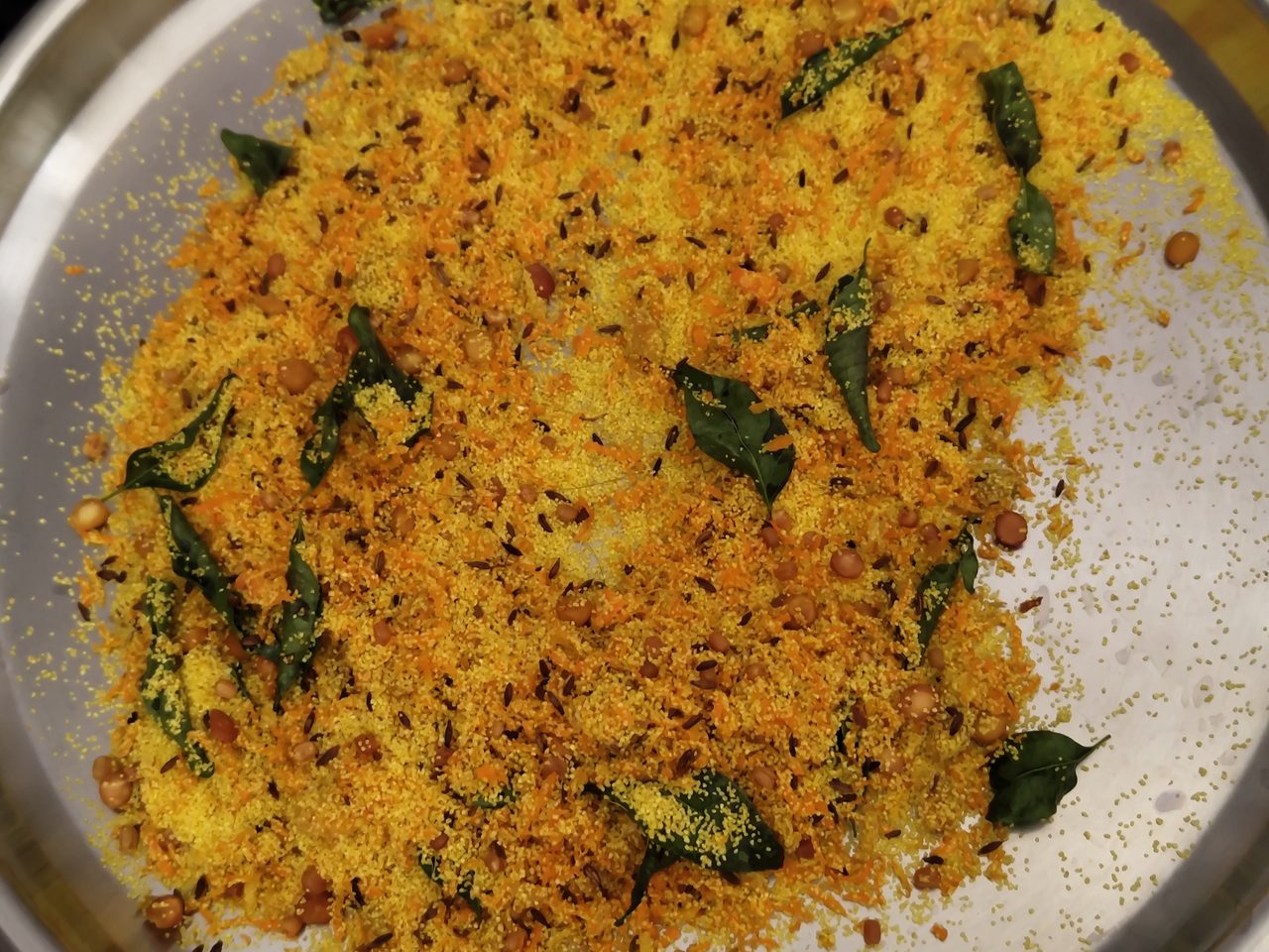 Fresh curry-leaf tadka with carrot and coconut
